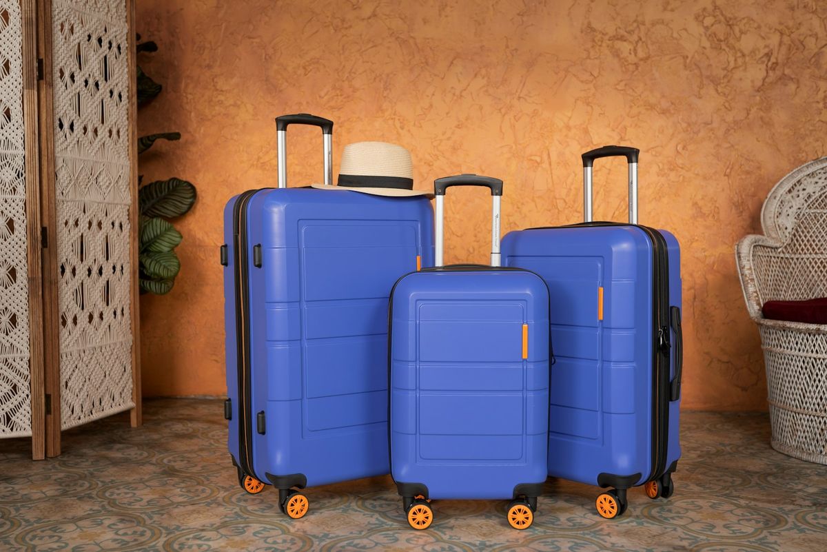 Three suitcases of different sizes side by side