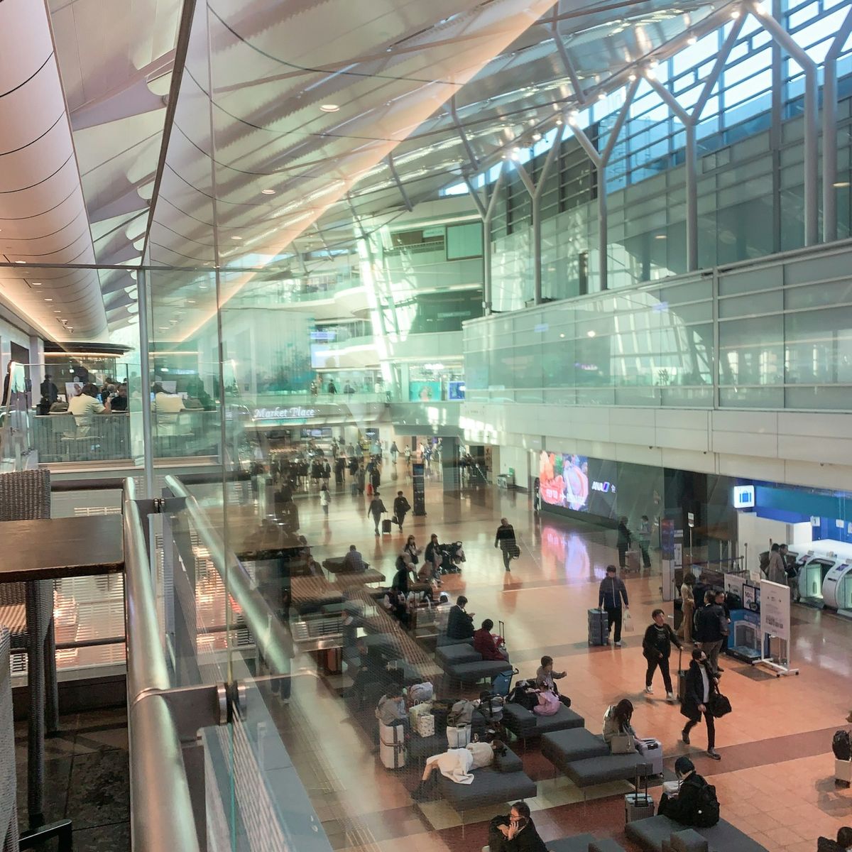 Busy airport terminal with travelers queuing