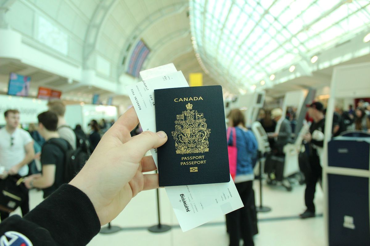 Traveler holding a Canadian passport