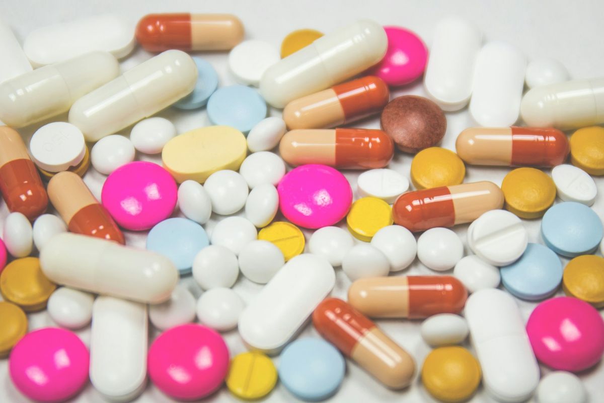 Assorted medication tablets and capsules