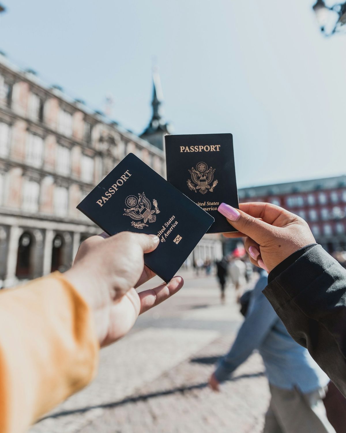 Person holding multiple passports