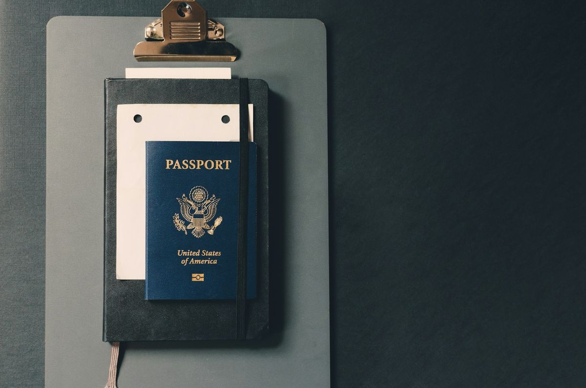 Passport on a clipboard with a form