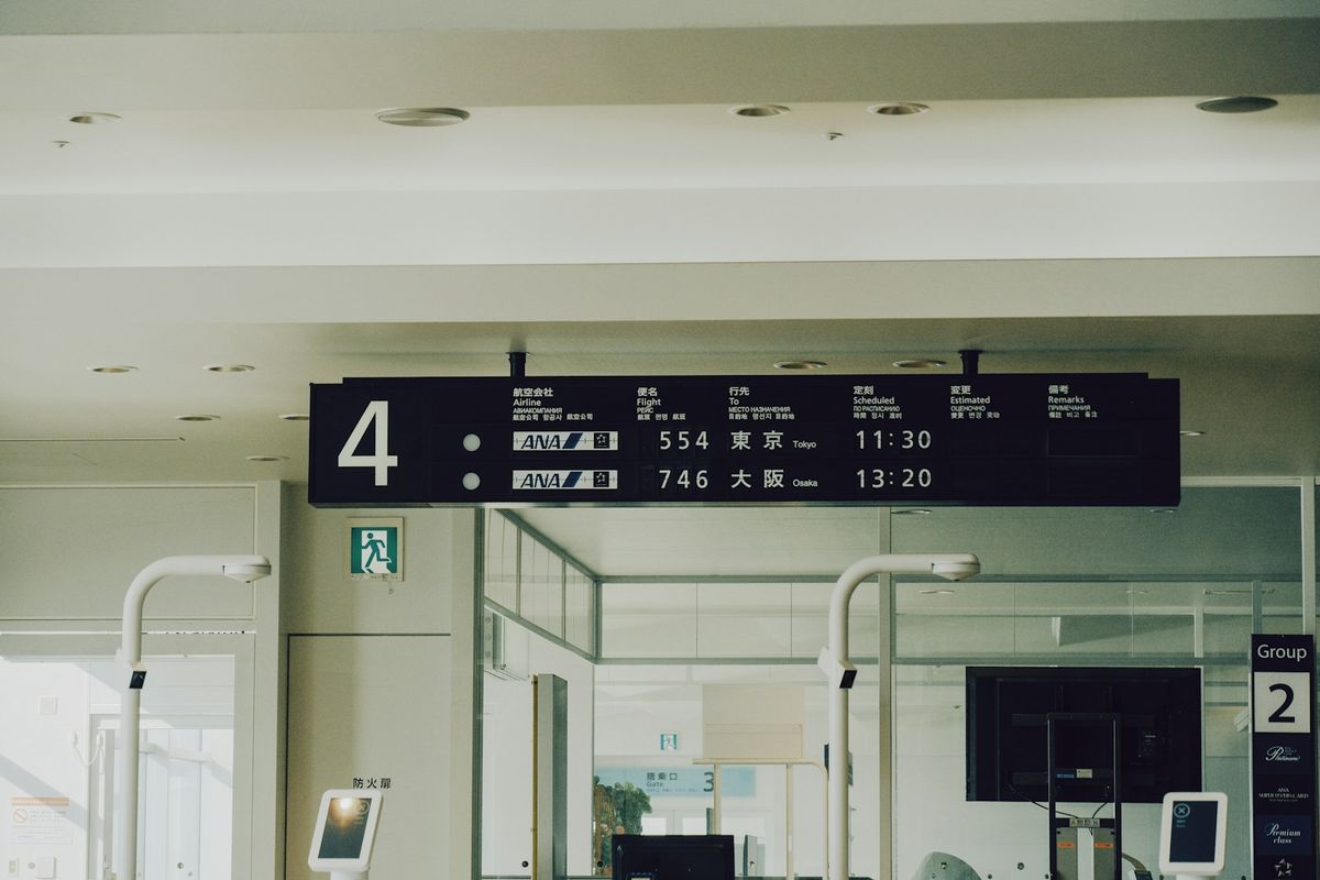 Airport departure board showing flight information