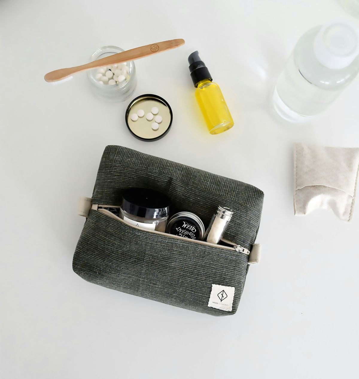 Toiletry bag with travel-size liquid containers for hand luggage