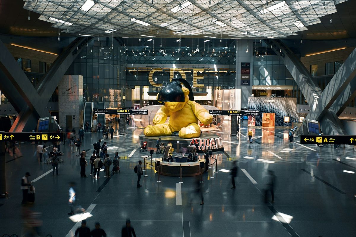 Busy airport terminal art installation Doha Qatar