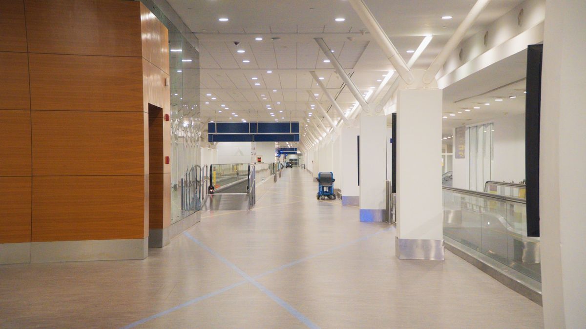 Moving walkway and escalators in a modern airport terminal