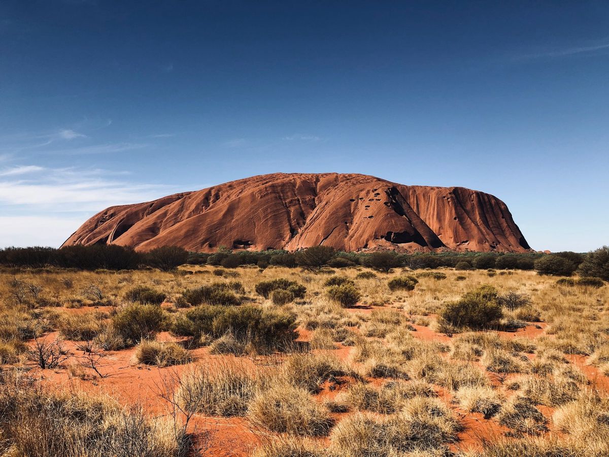 Uluru Ayers Rock monolith at sunset Australian outback landscape