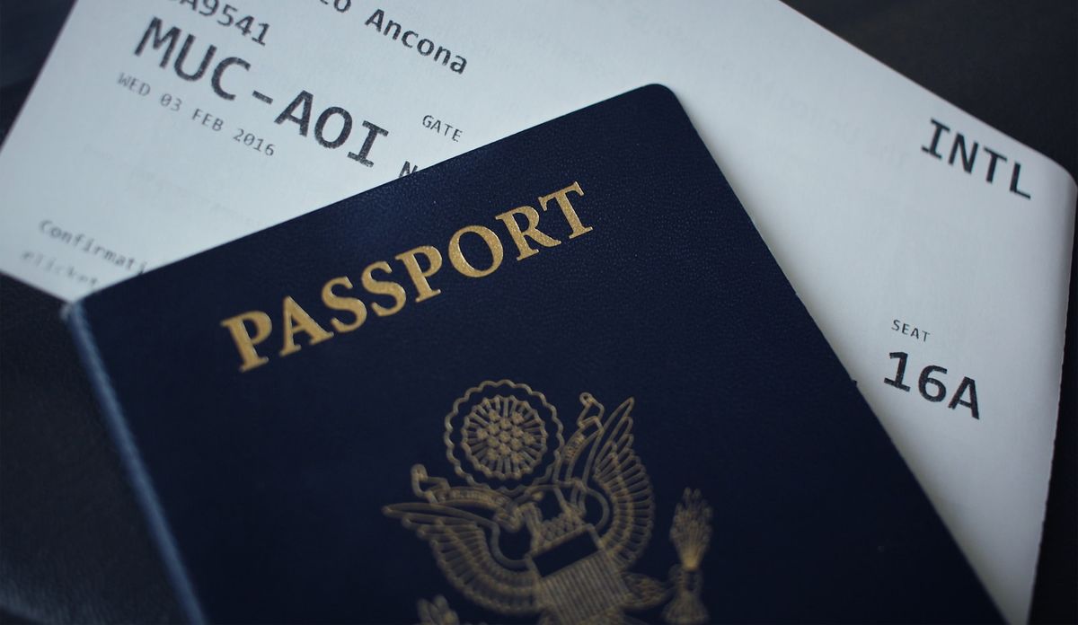 Passport booklet open on white paper