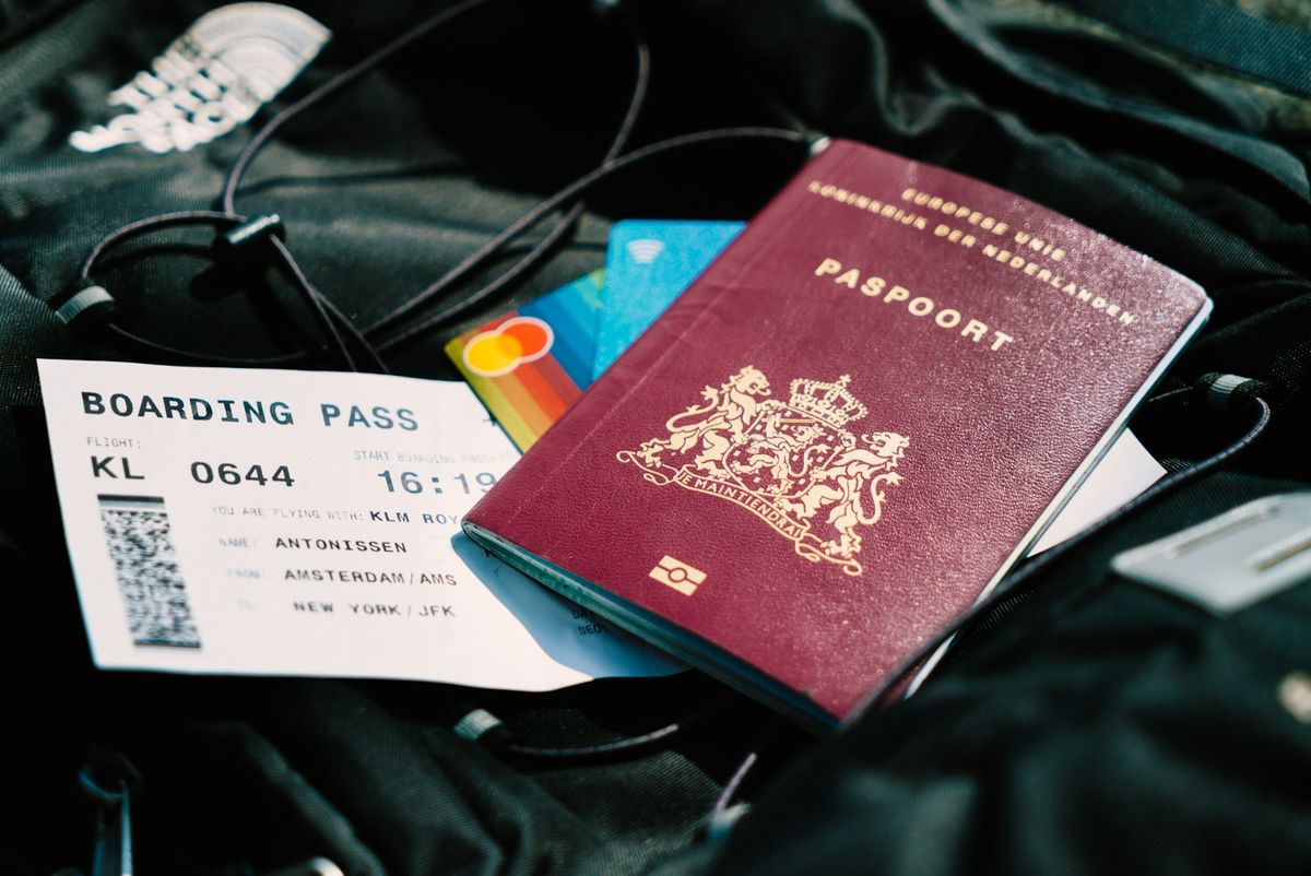 Passport and boarding pass on a travel bag