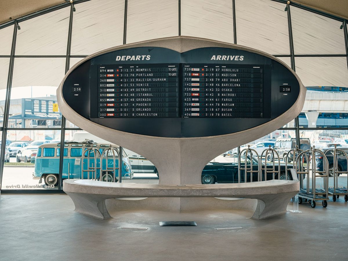 An airport flight information departures board