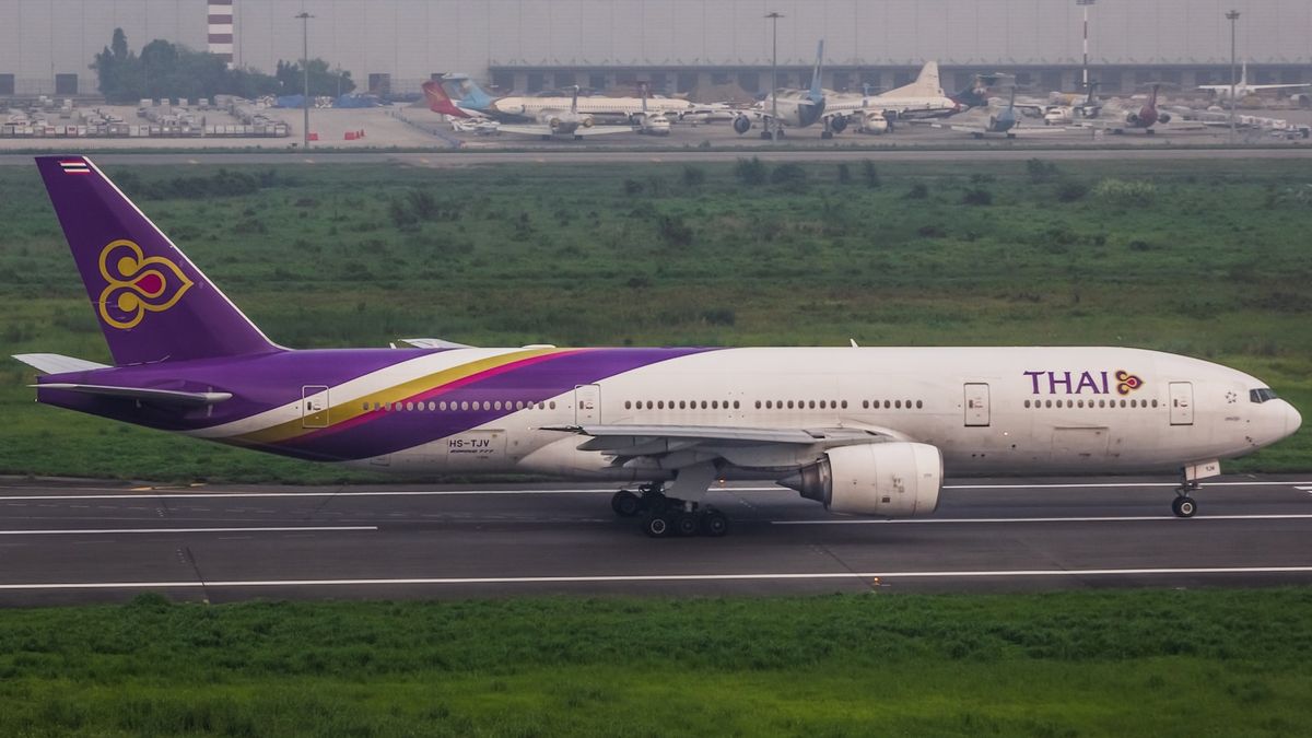 Thai Airlines plane on the runway at an airport in Thailand