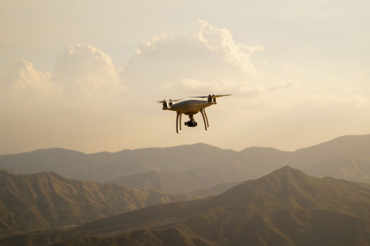 Drone flying over a mountain landscape