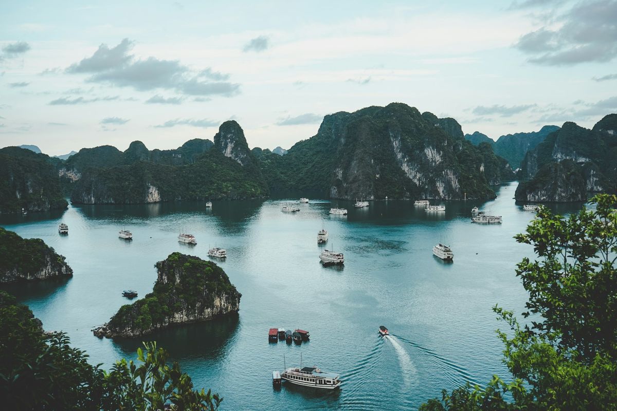 Boats on Ha Long Bay Vietnam with karst mountains