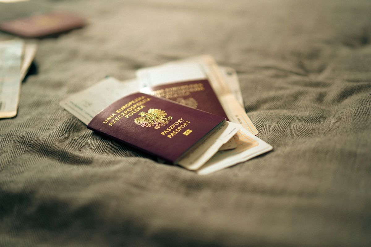 Multiple passports laid on neutral surface