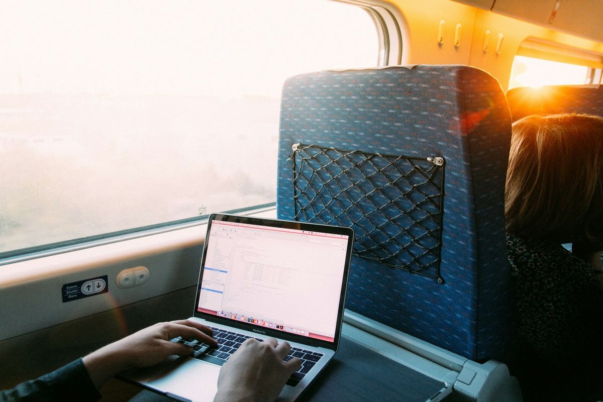 Person using a laptop to book travel online