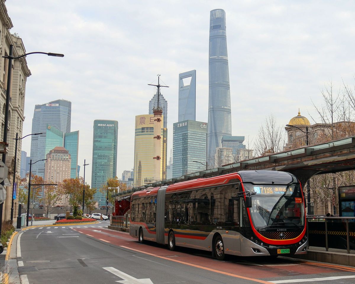 Modern articulated bus at a city bus stop in China