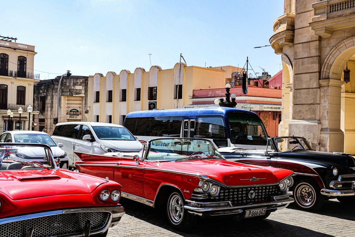 Classic cars parked on a colorful street in Havana, Cuba