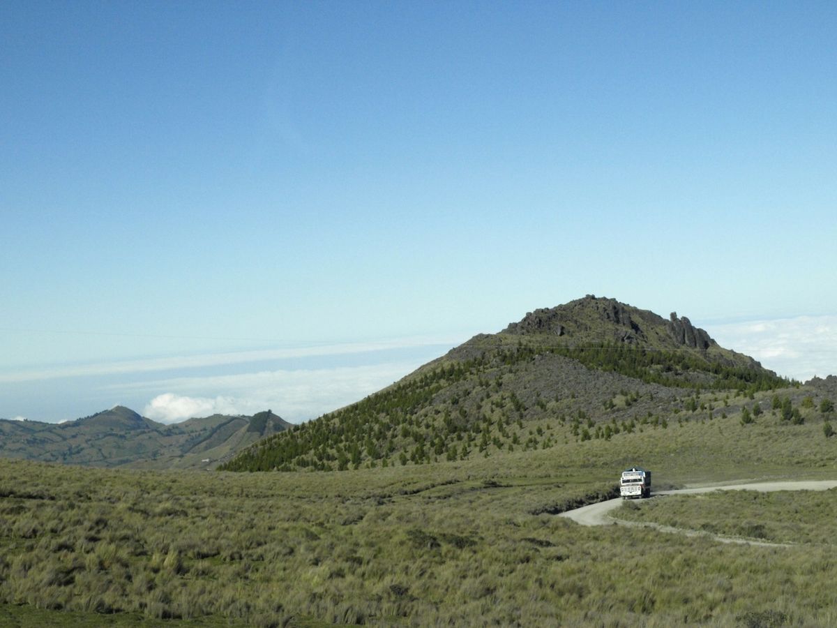 A van on a mountain road in the Ecuadorian Andes