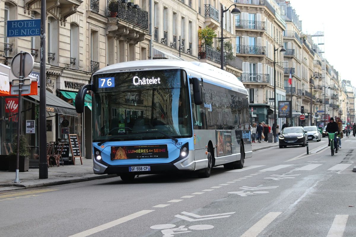 Bus driving on a city street in France