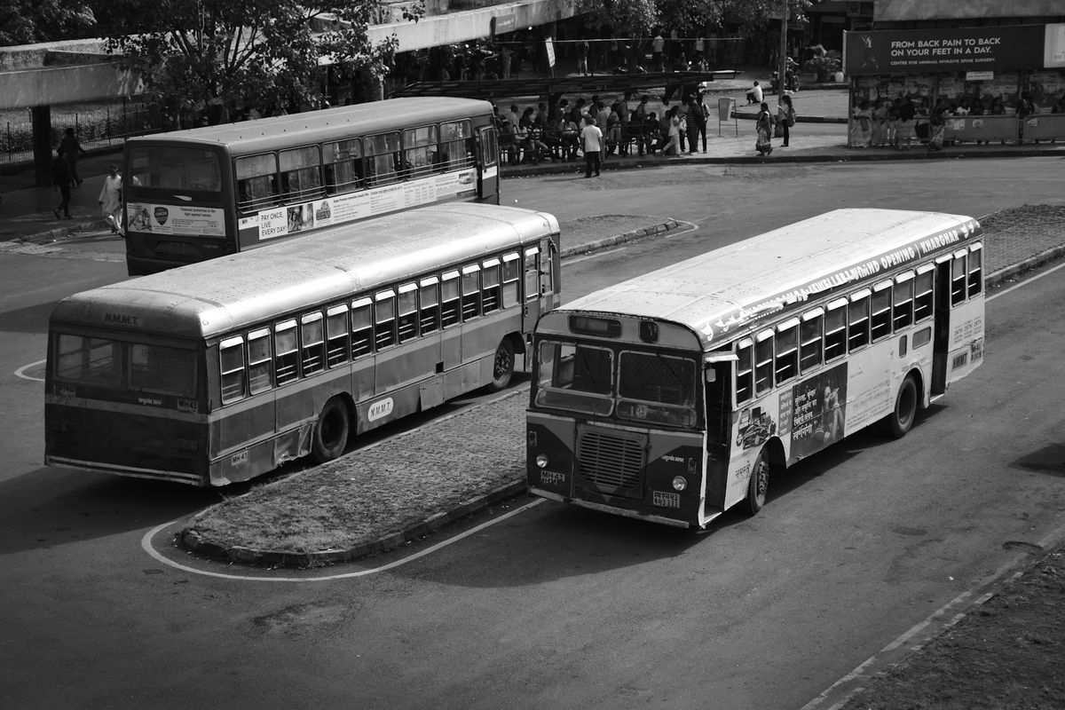 Buses parked on Indian city street India transport
