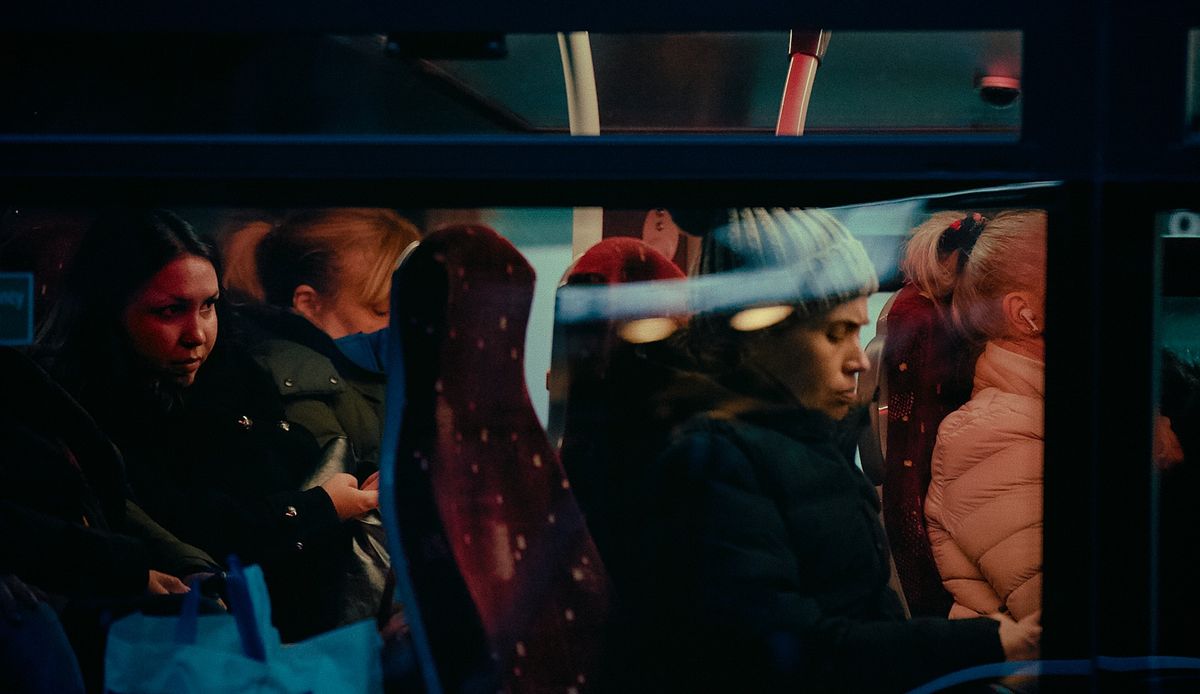 Passengers resting inside a bus at night