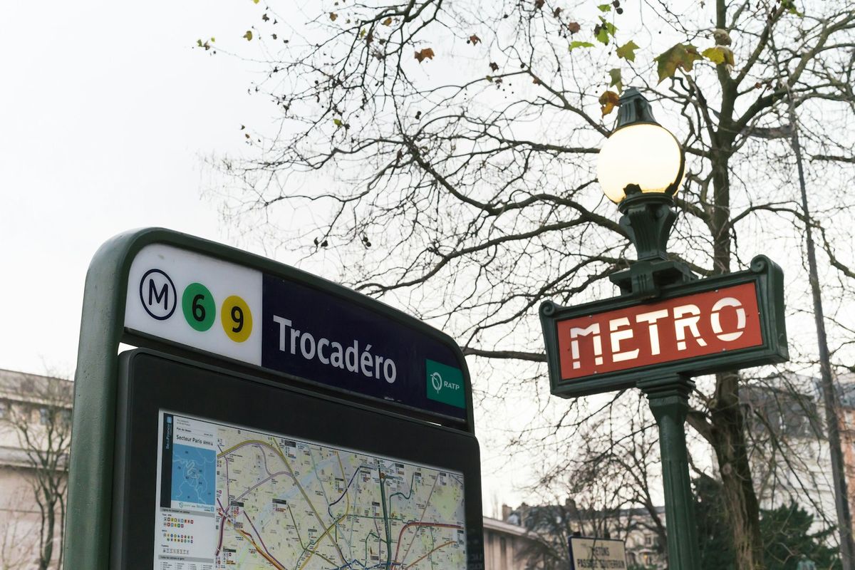 A bus stop sign displaying a route map for travelers