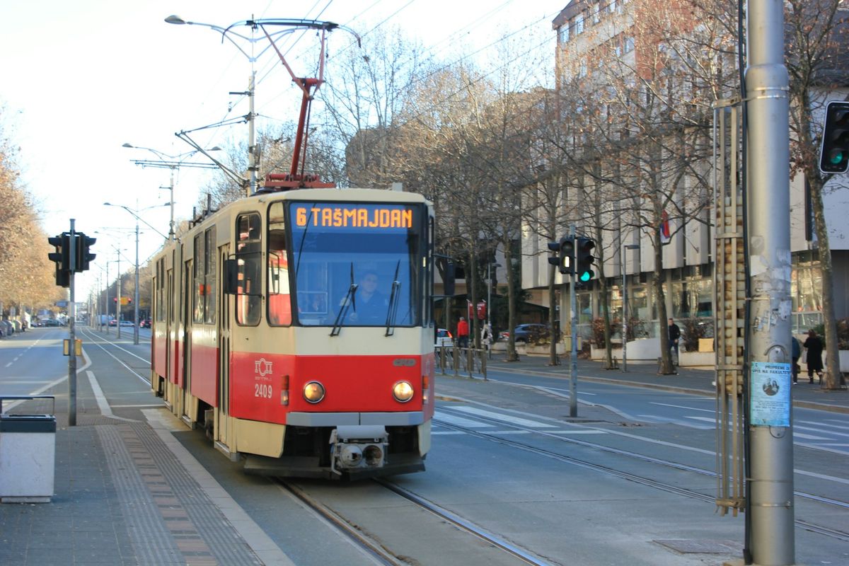 Red white and blue trolleybus on a Belgrade city street