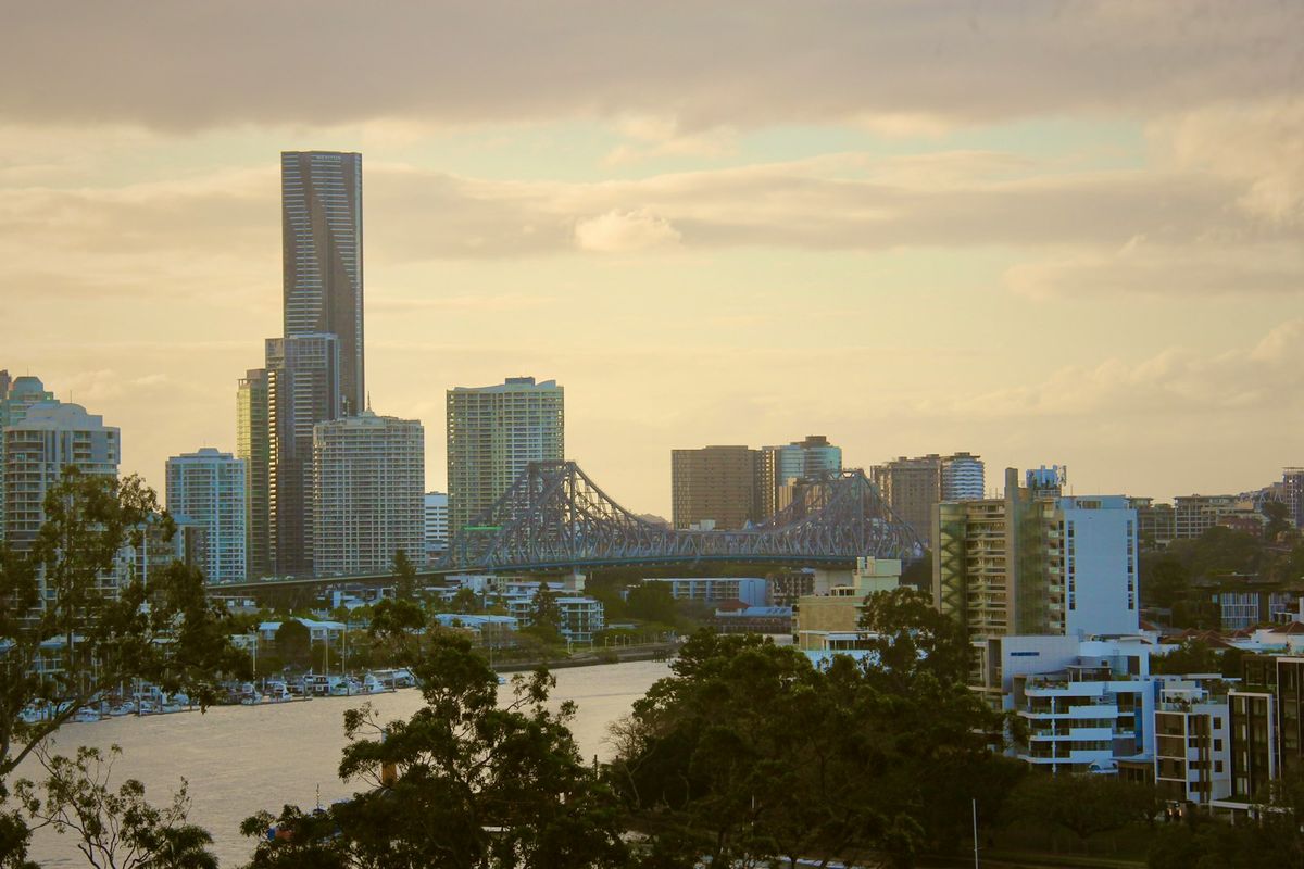 Brisbane skyline and Story Bridge over the river at sunset
