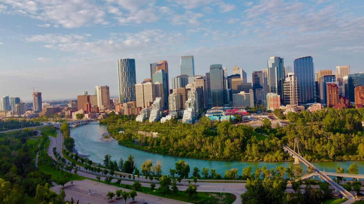 Aerial view of Calgary skyline with the Bow River and parkland