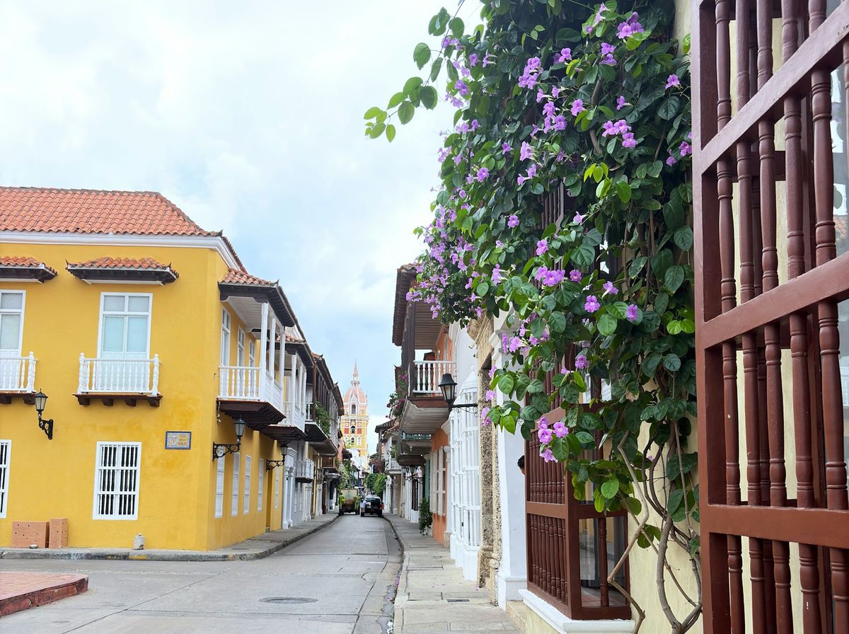 Colourful colonial street with flowering vines in Cartagena old town