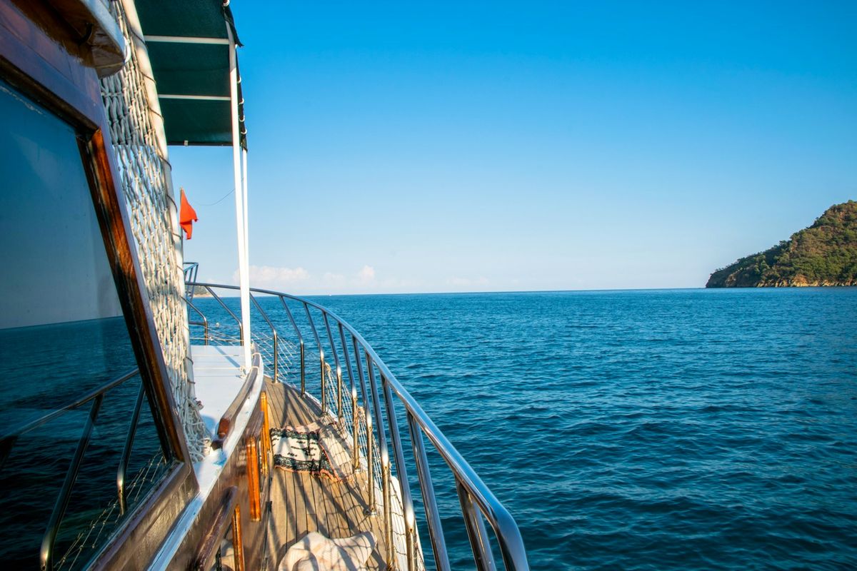 View of the Mediterranean coastline from a boat deck