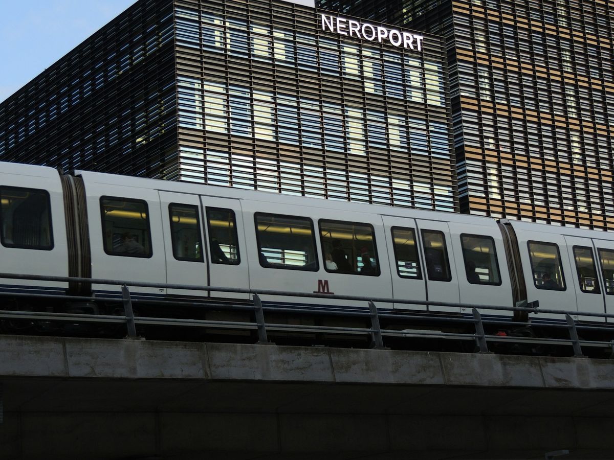 Modern white driverless metro train arriving in Copenhagen