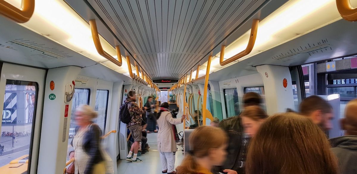 People standing on a Copenhagen subway train