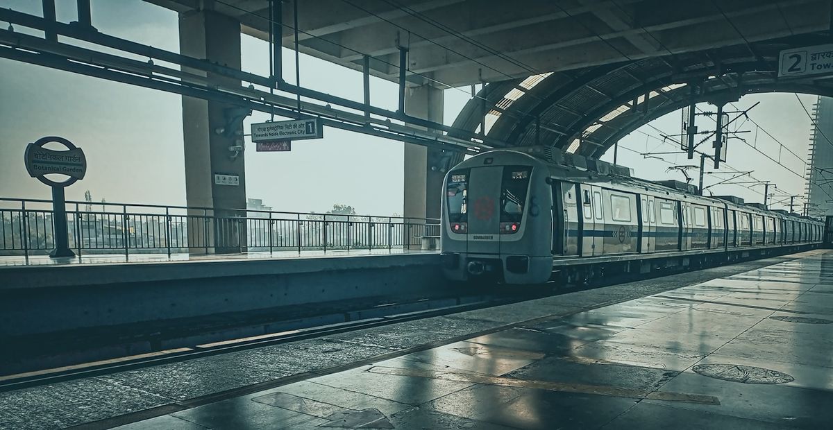 Delhi Metro train arriving at a station platform