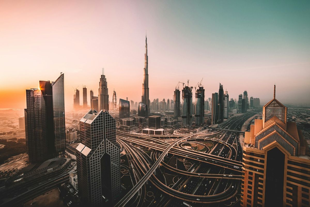 Aerial view of Dubai city with highways and high-rise skyscrapers