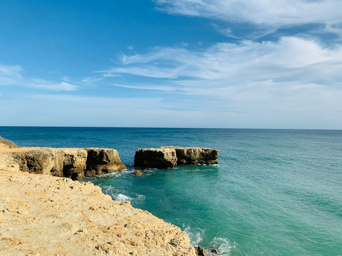 Algarve golden rock cliffs and sea, Faro region Portugal