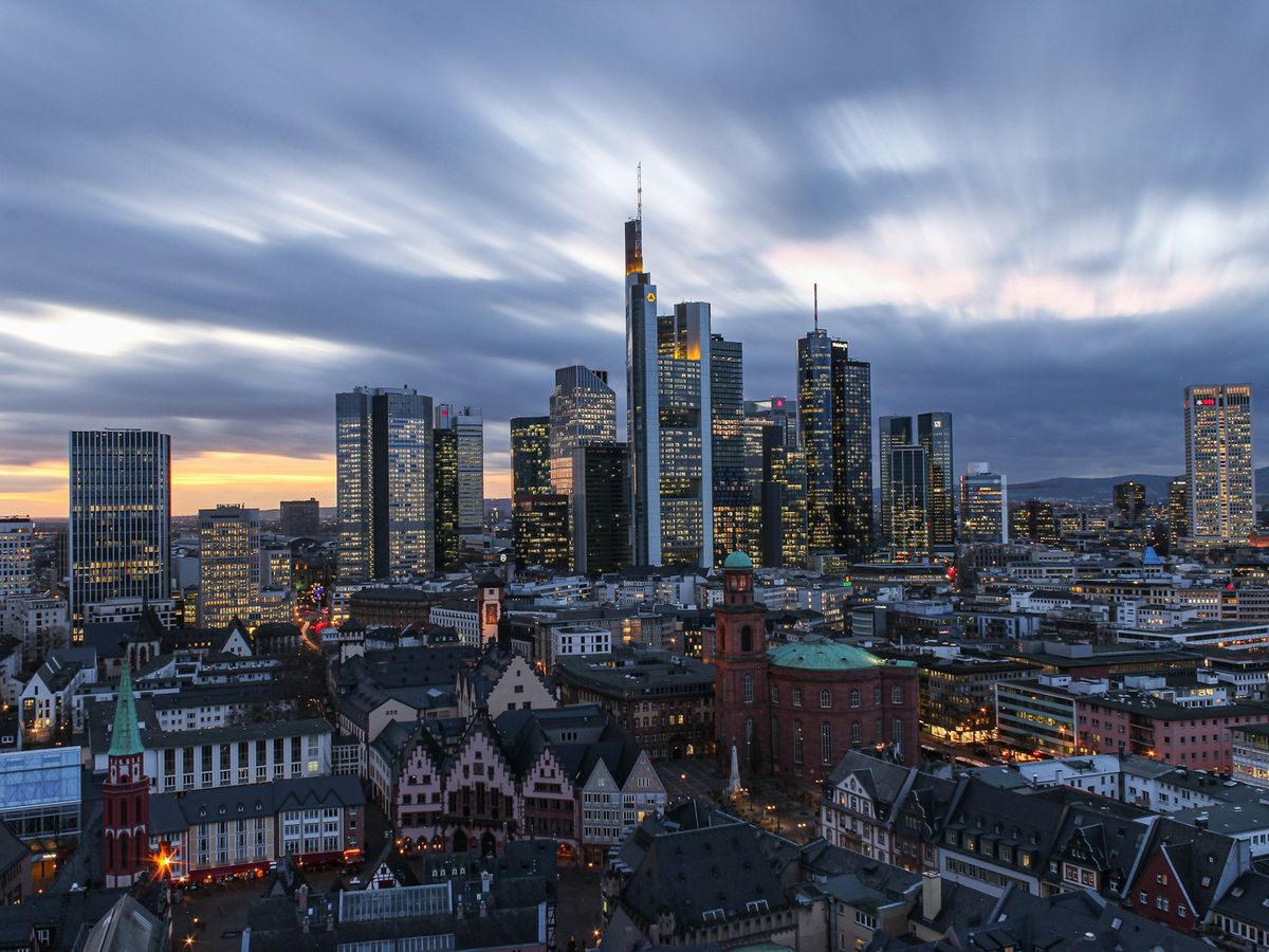 Frankfurt city skyline with modern skyscrapers under white clouds