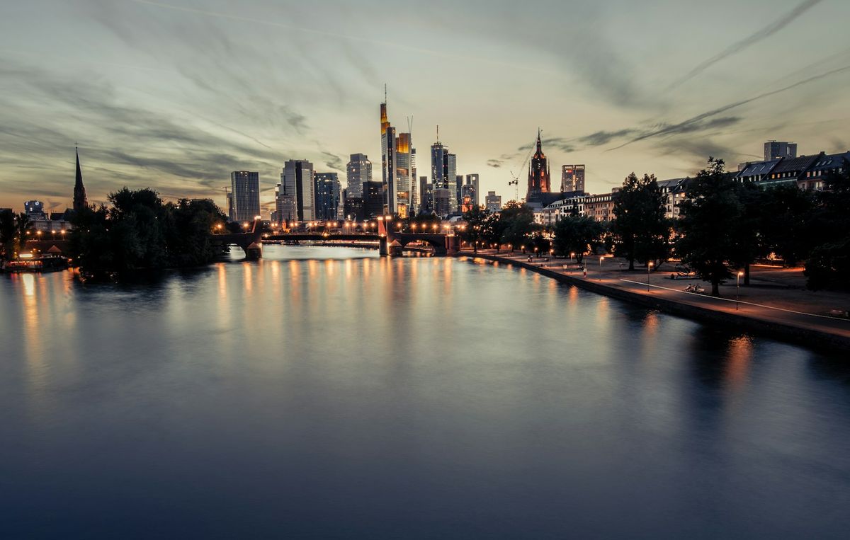 Frankfurt city skyline under white clouds