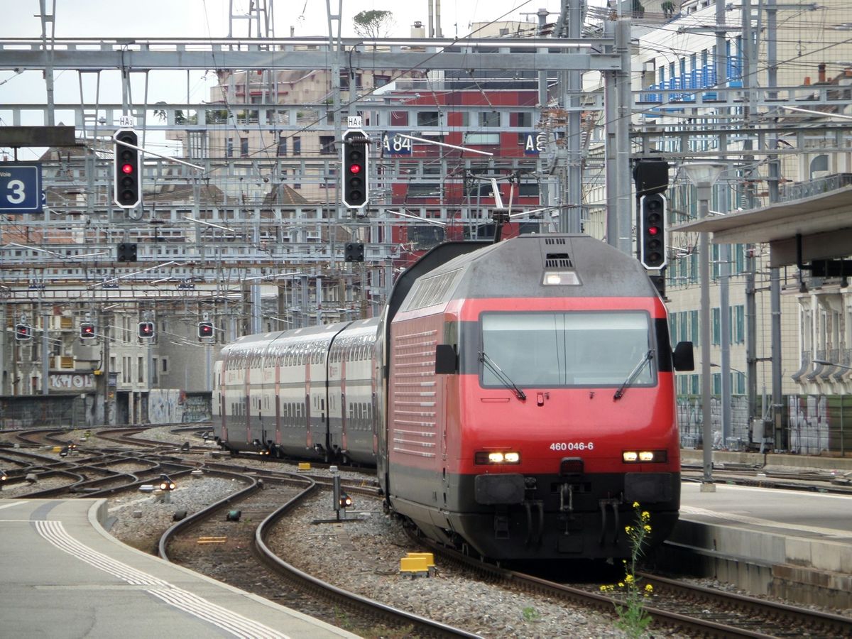 Red and silver train on railway tracks in Switzerland