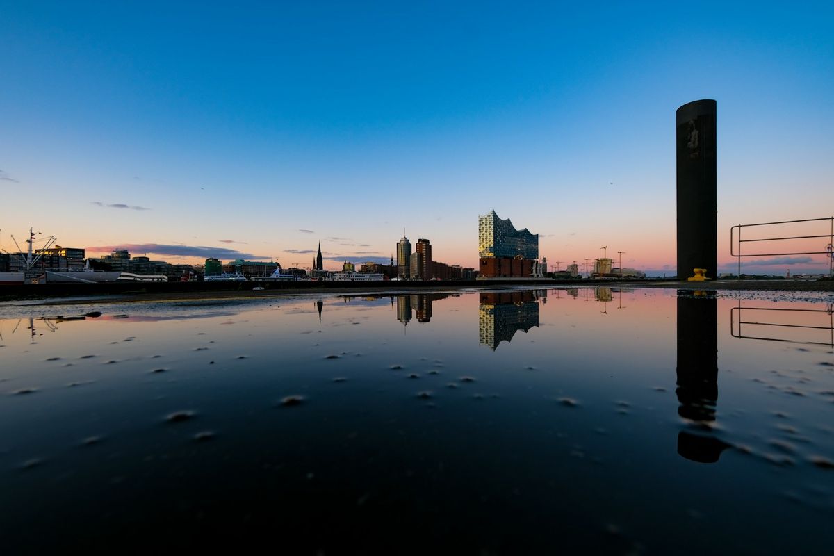 Hamburg city buildings reflected in the waterway