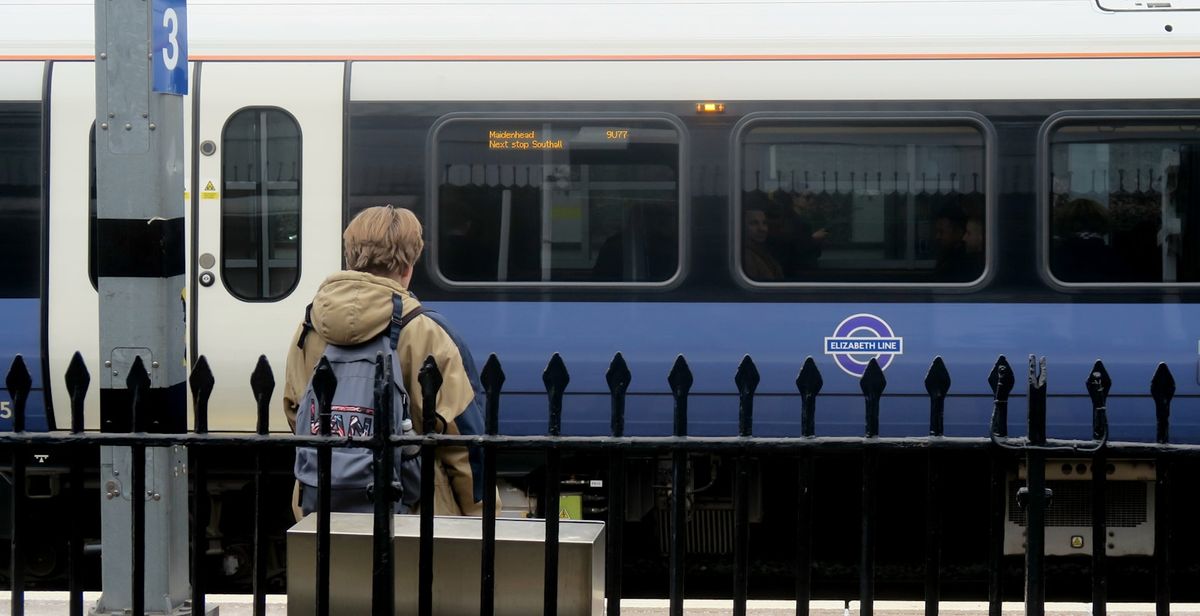 Elizabeth line purple train arriving at a London platform