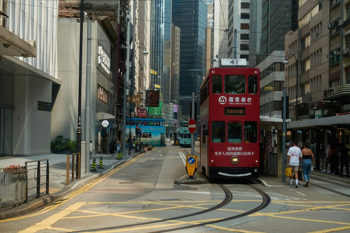 Red double-decker tram on a Hong Kong city street