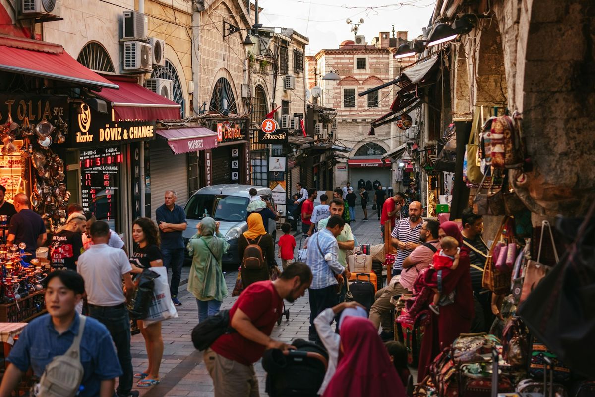 Crowd of people walking through Istanbul Grand Bazaar street