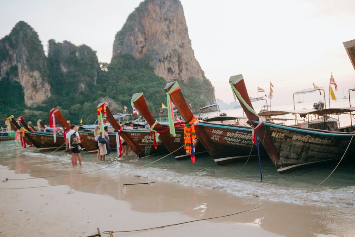 Longtail boats lined up on Ao Nang beach in Krabi, Thailand