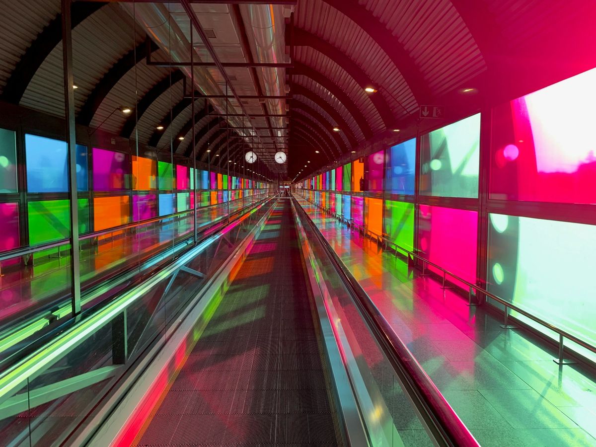 Colorful terminal tunnel at Madrid Barajas Airport
