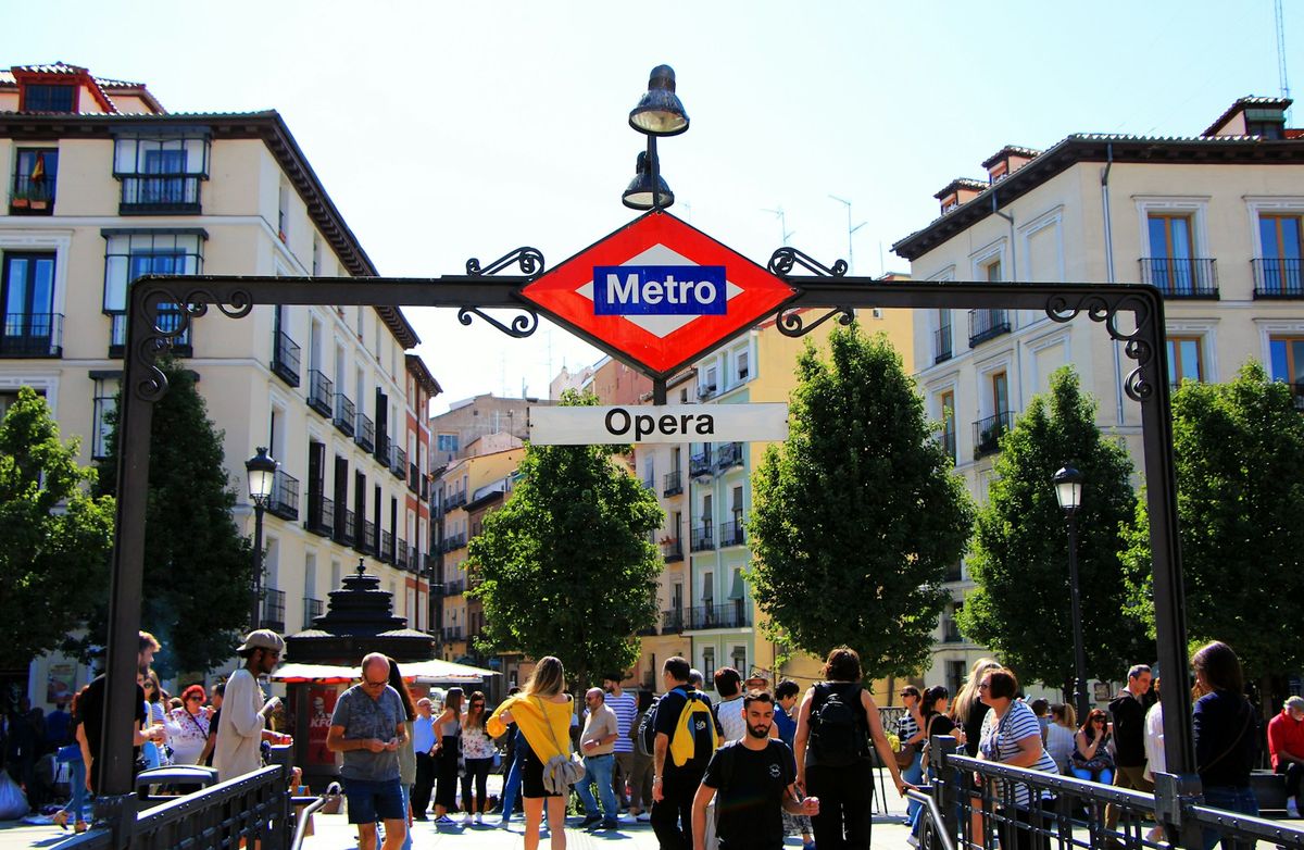 People at the Metro Opera station entrance in Madrid