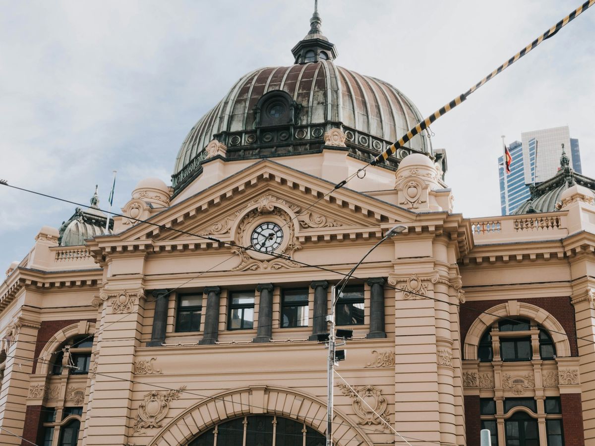 Flinders Street Station in Melbourne under a bright sky