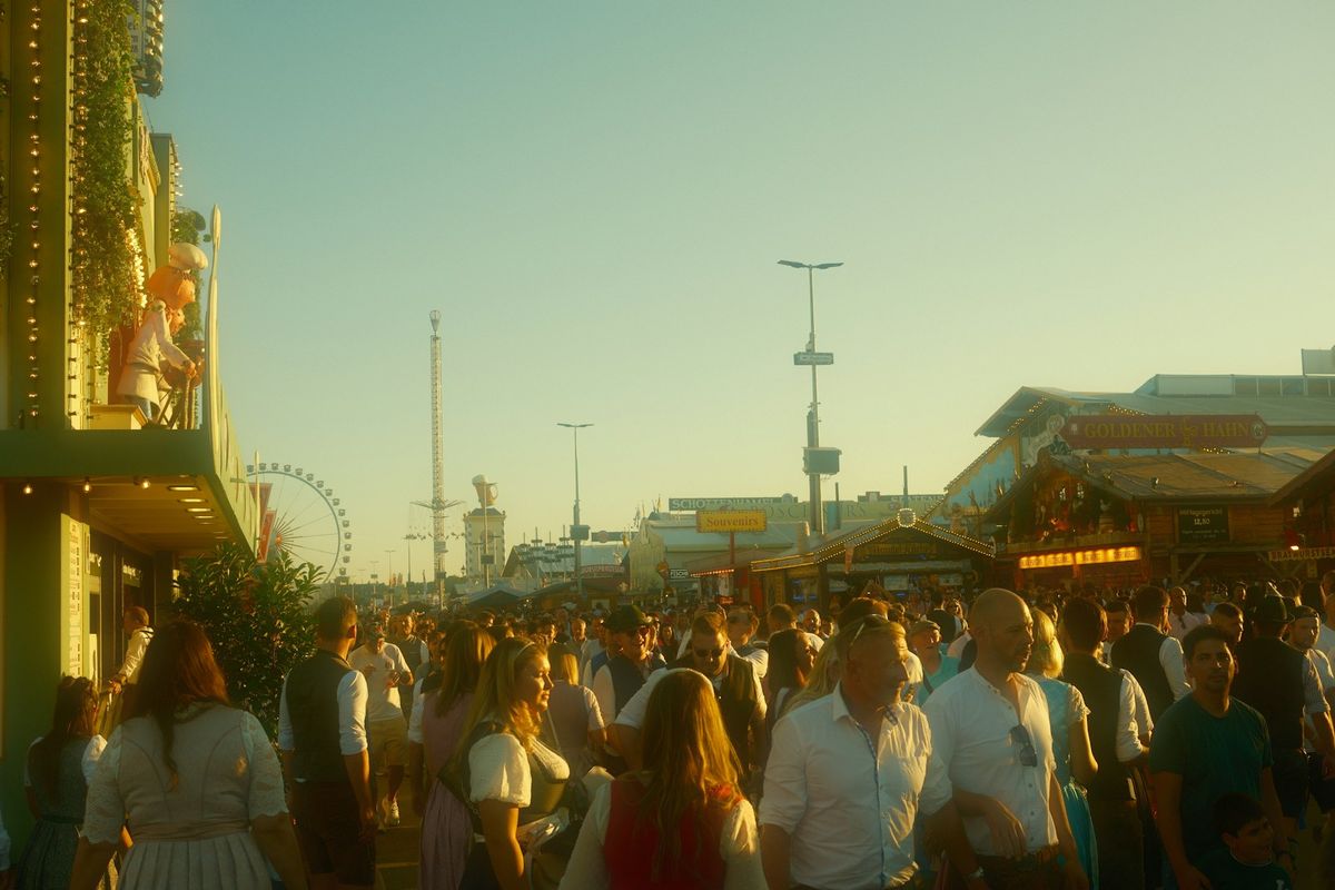 Crowds walking through the Oktoberfest festival grounds in Munich