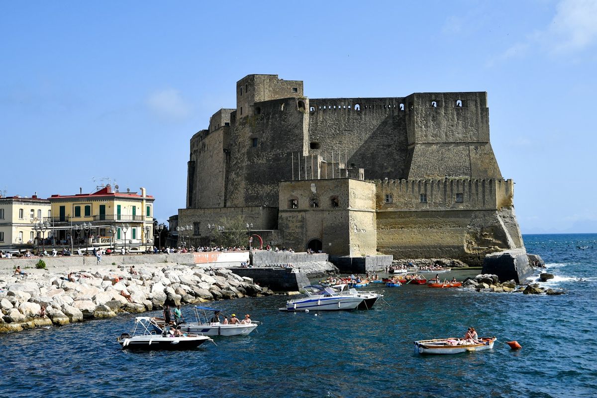 Castel dell'Ovo fortress on the Naples waterfront with boats