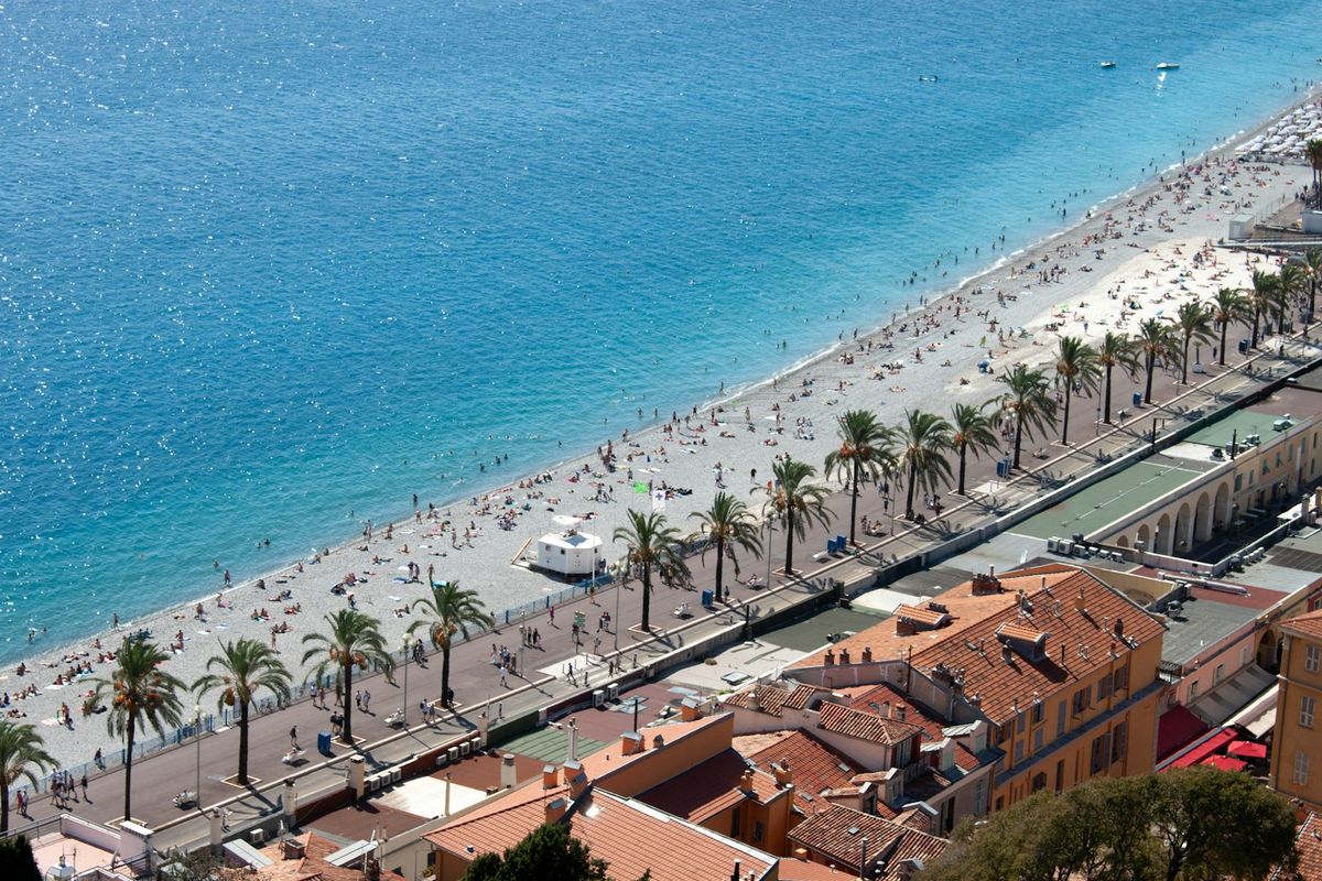 Crowded beach on the Promenade des Anglais in Nice, France